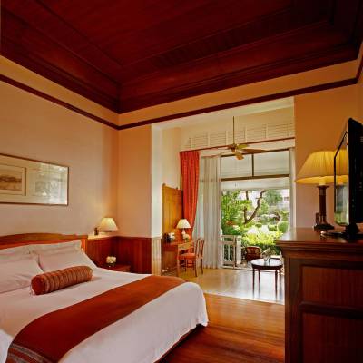 a bedroom with a bed in a room