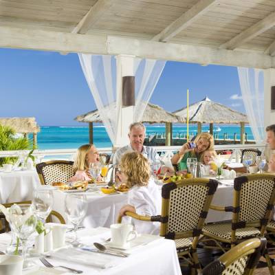 a group of people sitting at a dining table