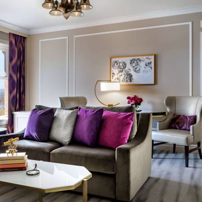 a living room filled with furniture and a large window