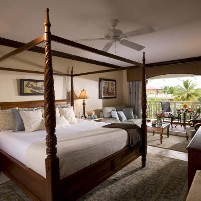 a bedroom with a large bed in a hotel room