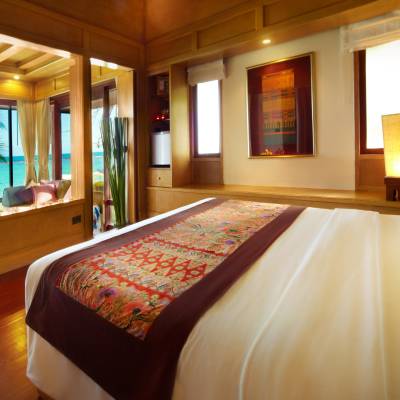 a bedroom with a large bed in a hotel room
