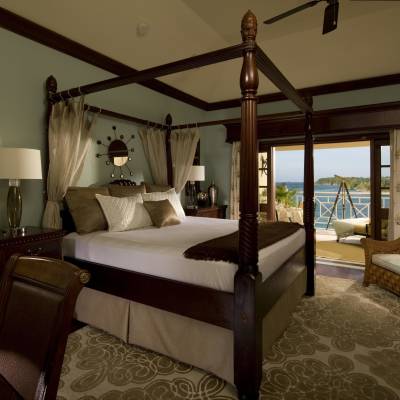 a bedroom with a large bed in a room
