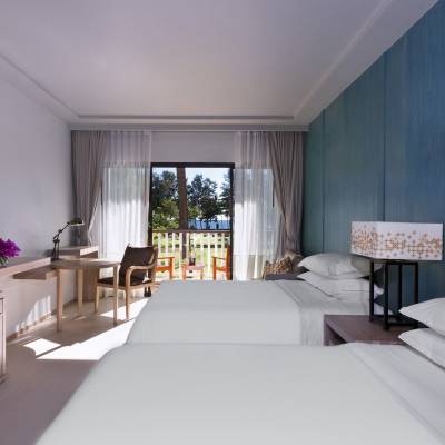 a bedroom with a large bed in a room