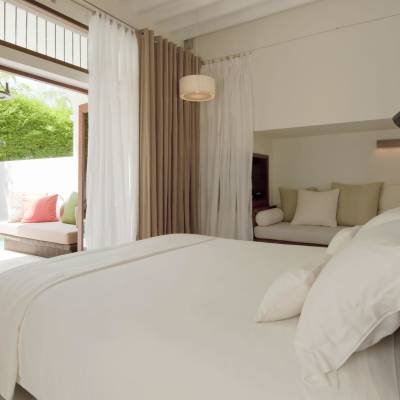 a large white bed in a room