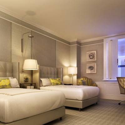 a bedroom with a bed in a room