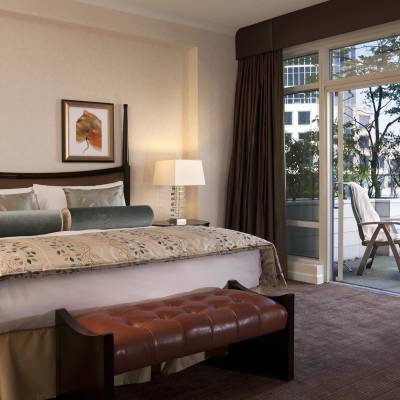 a bedroom with a large bed in a hotel room