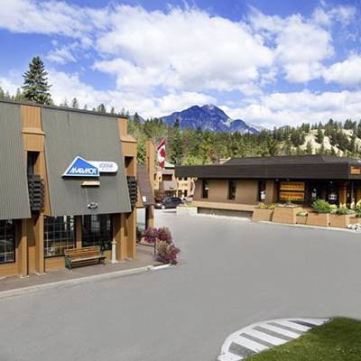 a building with a store on the side of a road