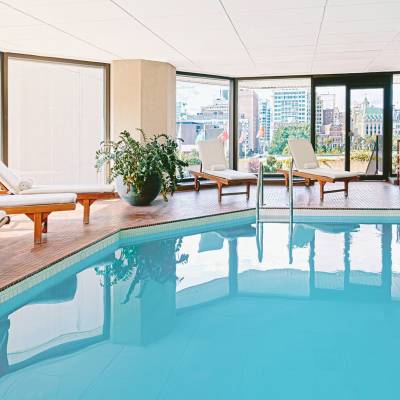 a room with a pool in front of a window