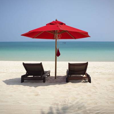 an umbrella sitting on top of a beach