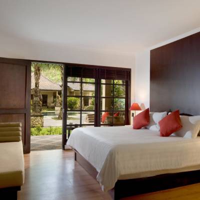 a bedroom with a large bed in a hotel room