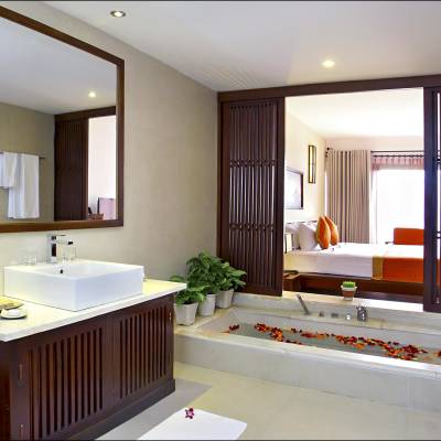 a room with a sink and a mirror