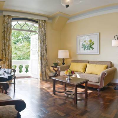 a living room filled with furniture and a large window