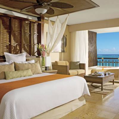 a bedroom with a large bed in a hotel room