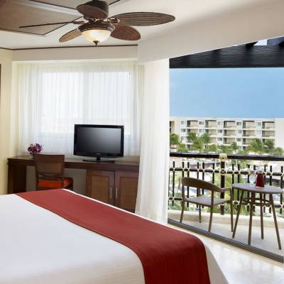 a bedroom with a large bed in a room