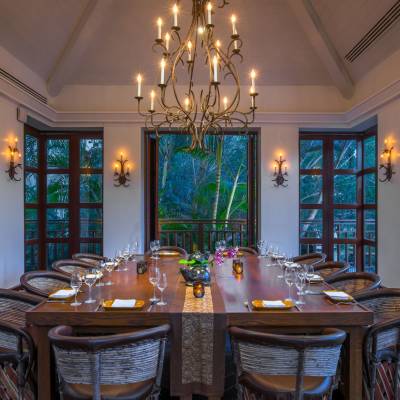 a dining room table in front of a window