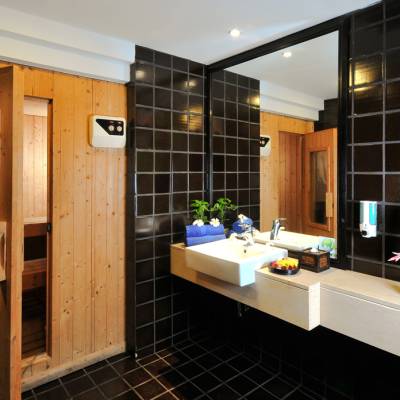 a room with a sink and a mirror