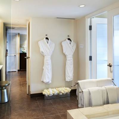 a room filled with furniture and a large mirror