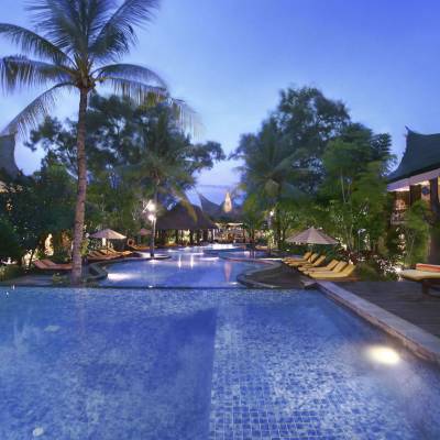 a pool next to a tree