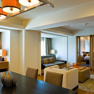 a living room filled with furniture and a large window