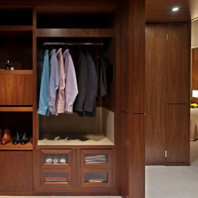 a kitchen with wooden cabinets and a mirror