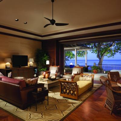 a living room filled with furniture and a large window