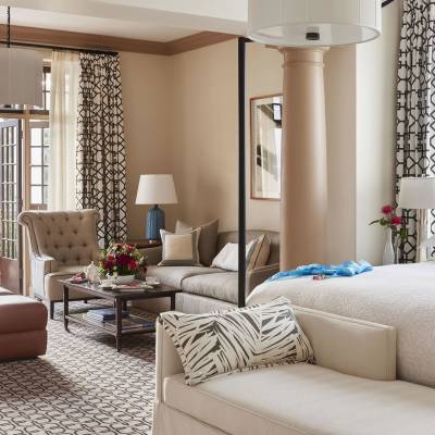 a hotel room with a bed and a window
