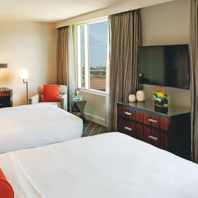 a bedroom with a large bed in a hotel room