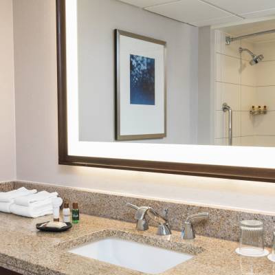 a room with a sink and a mirror