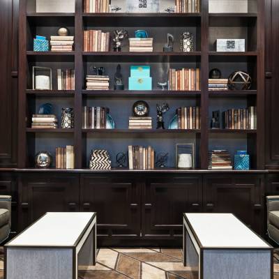 a living room with a book shelf