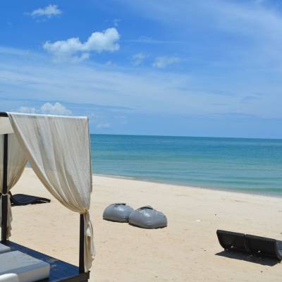 an umbrella sitting on top of a beach