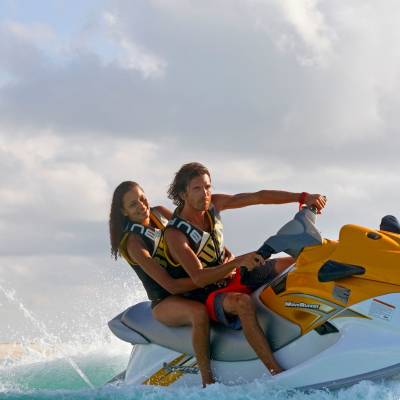 a person riding a surf board on a body of water