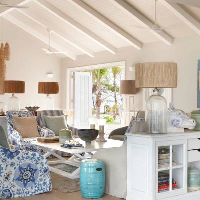 a living room filled with furniture and a fire place