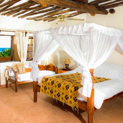a room filled with furniture and a bed