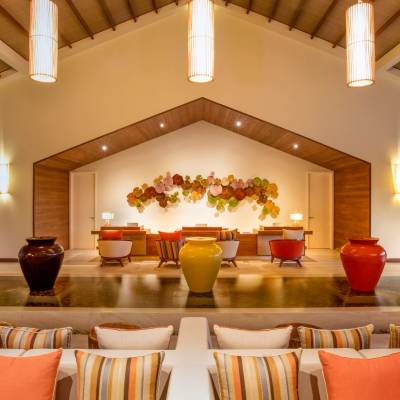 a living room filled with furniture and vase on a table