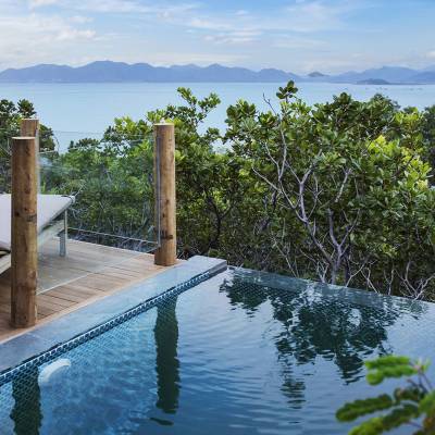 a pool next to a body of water