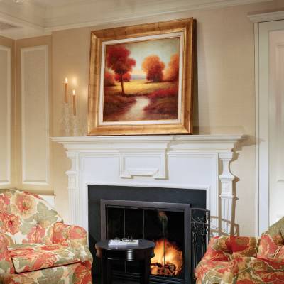 a living room filled with furniture and a fire place
