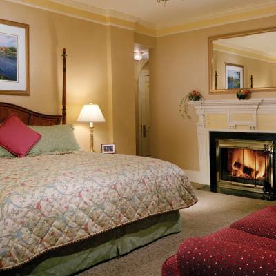 a bedroom with a bed in a room