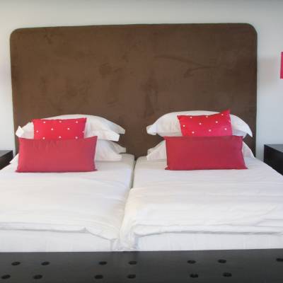 a large red bed in a room