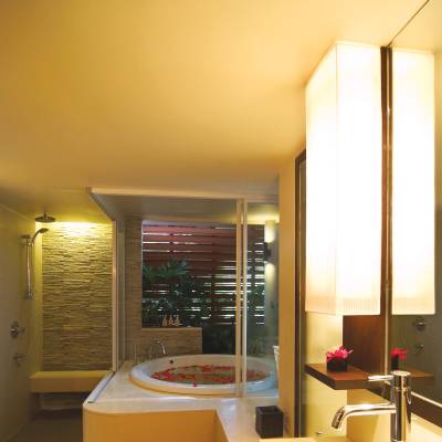 a large white tub sitting next to a window