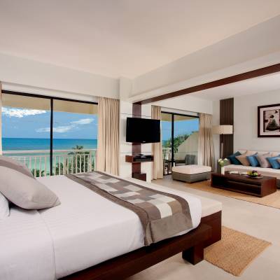 a bedroom with a large bed in a hotel room
