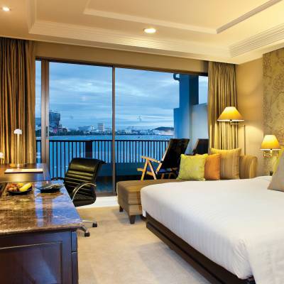 a bedroom with a large bed in a hotel room