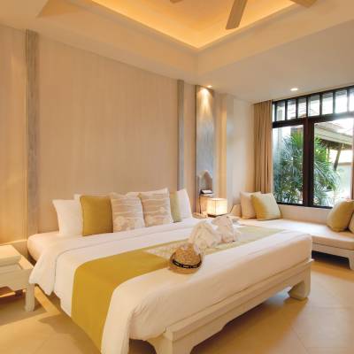 a living room filled with furniture and a large window