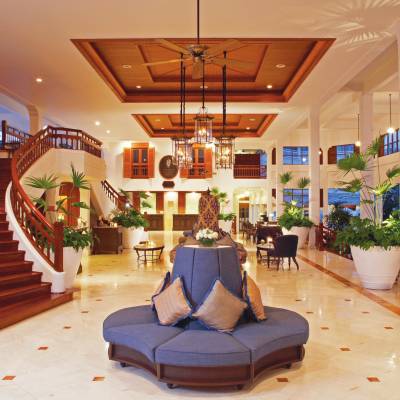 a living room filled with furniture and a fireplace