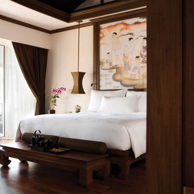 a bedroom with a large mirror