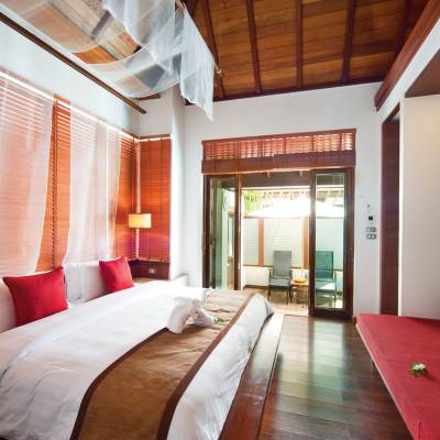 a bedroom with a large bed in a hotel room