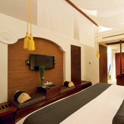 a bedroom with a bed in a room