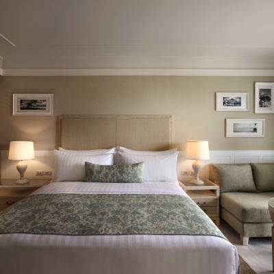 a bedroom with a large bed in a hotel room