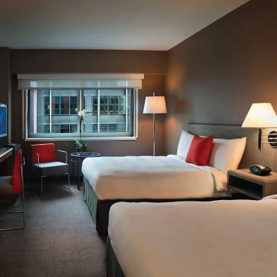 a bedroom with a large bed in a hotel room