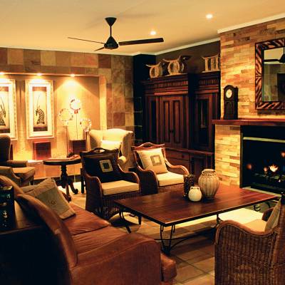 a living room filled with furniture and a fire place