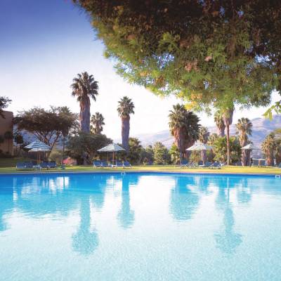 a pool next to a body of water